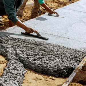 two men leveling concrete slabs